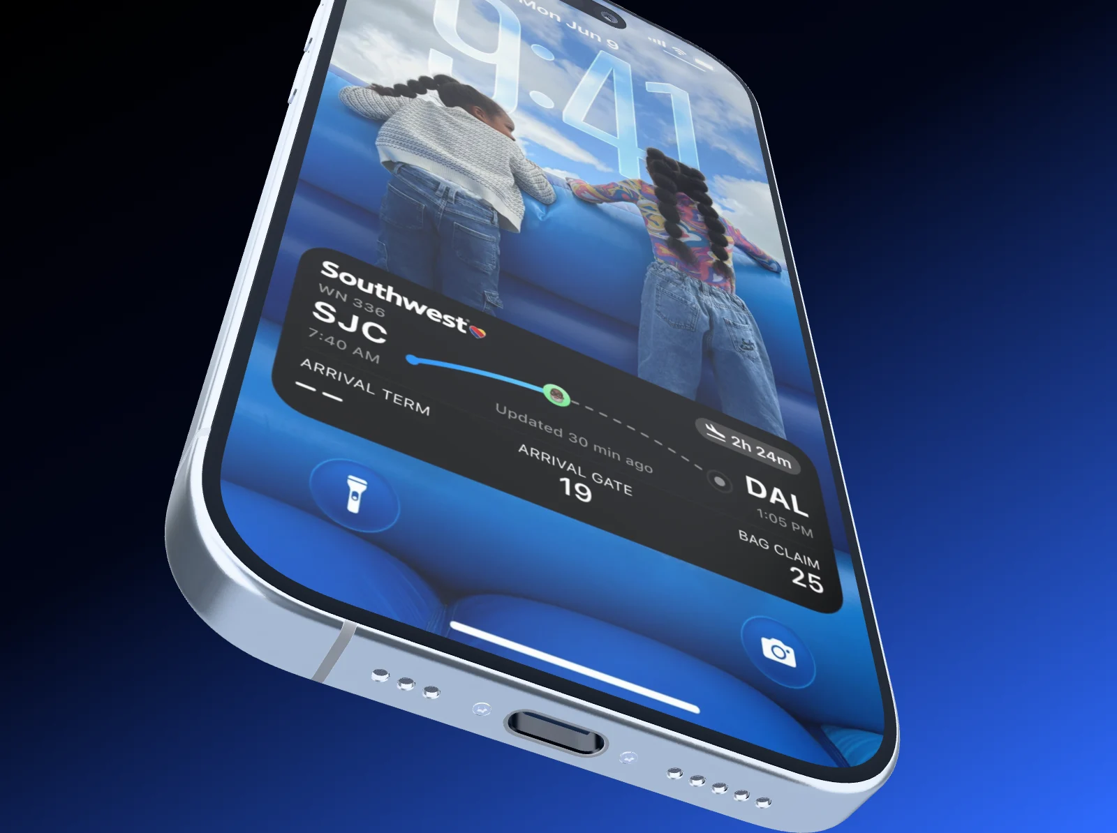 An iPhone 17 in steep perspective, tipped toward the camera from its bottom edge.