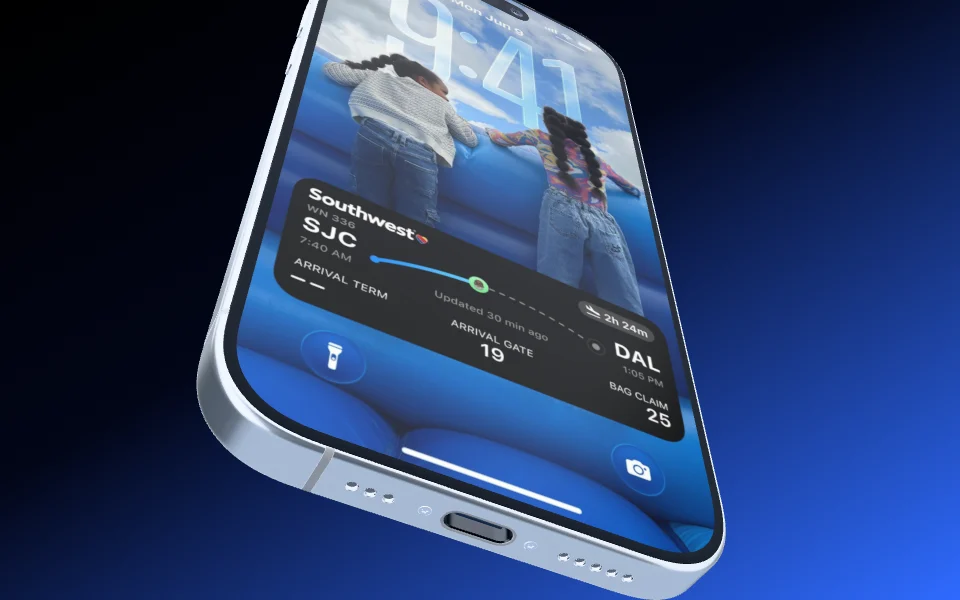 An iPhone 17 in steep perspective, tipped toward the camera from its bottom edge.